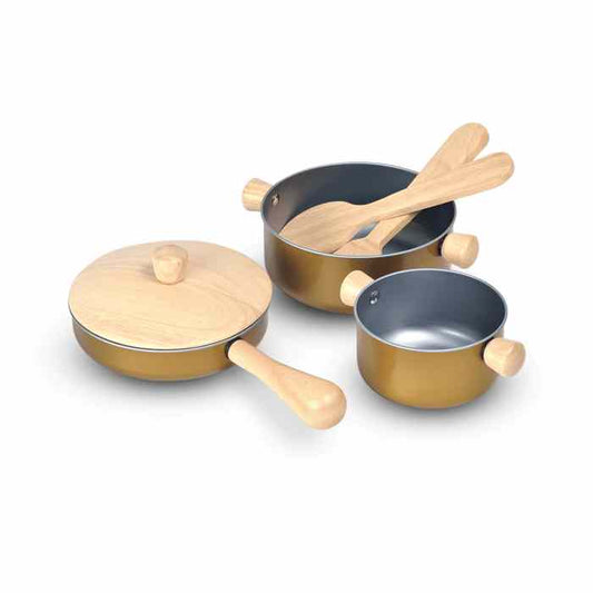 Set of toy cookware with wooden handles on a white background