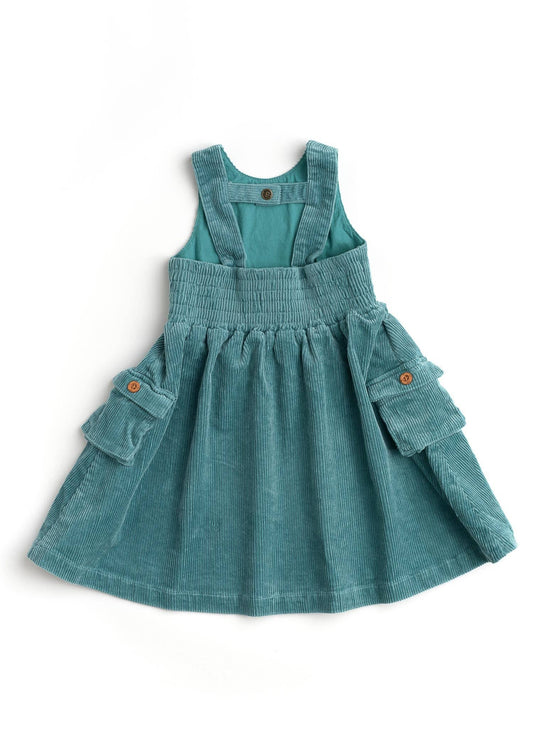 Teal denim pinafore dress on a white background