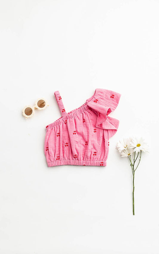 Girls Pink crop top with ruffled details on a white background