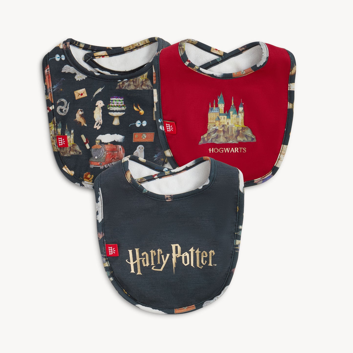 Three Harry Potter-themed baby bibs on a white background