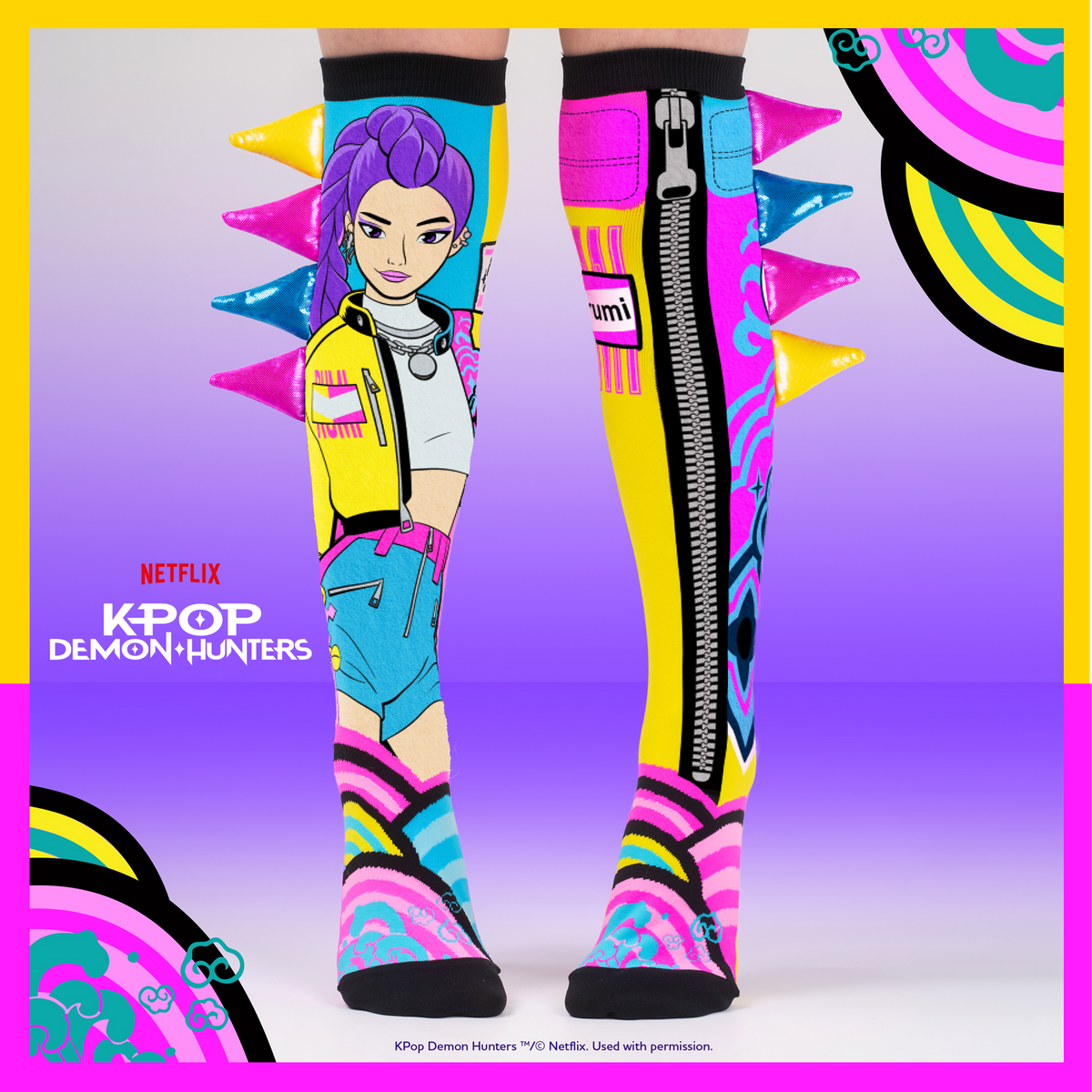 A pair of colorful K-pop themed knee-high socks featuring an anime character design, spiky accents, and a central zipper detail, shown against a purple gradient background with Netflix and Kpop Demon Hunters branding.