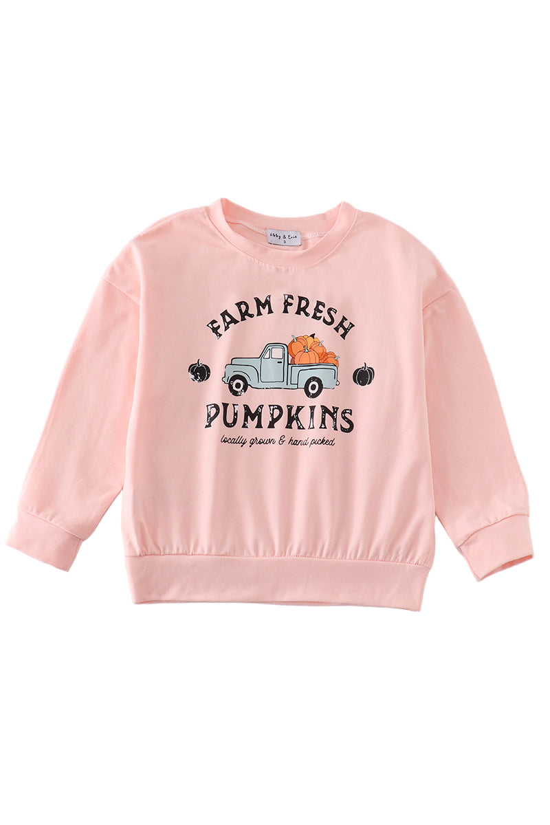 A long sleeve pink sweatshirt with 'Farm Fresh Pumpkins' text and a cartoon pumpkin graphic on the front.