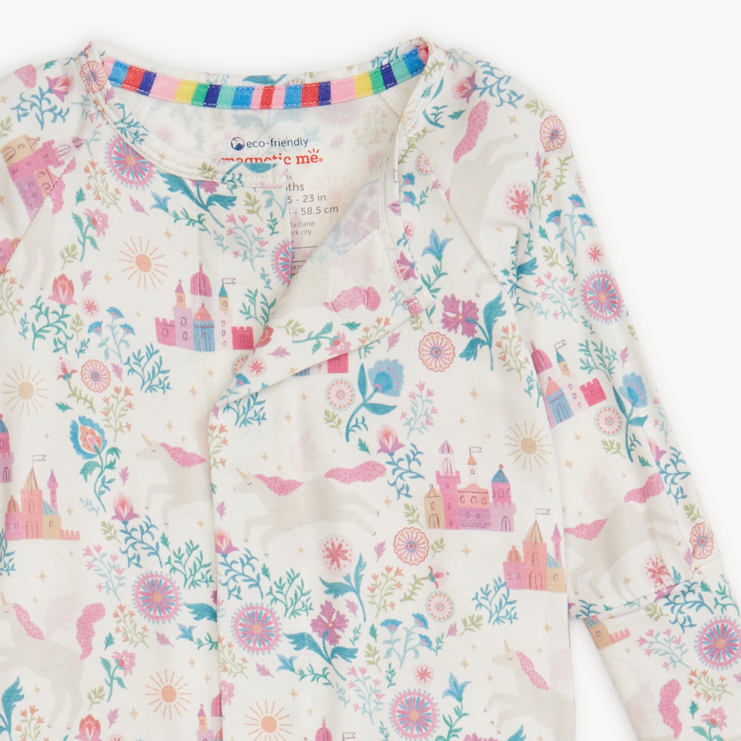 Children's outfit with floral and castle pattern on a white background