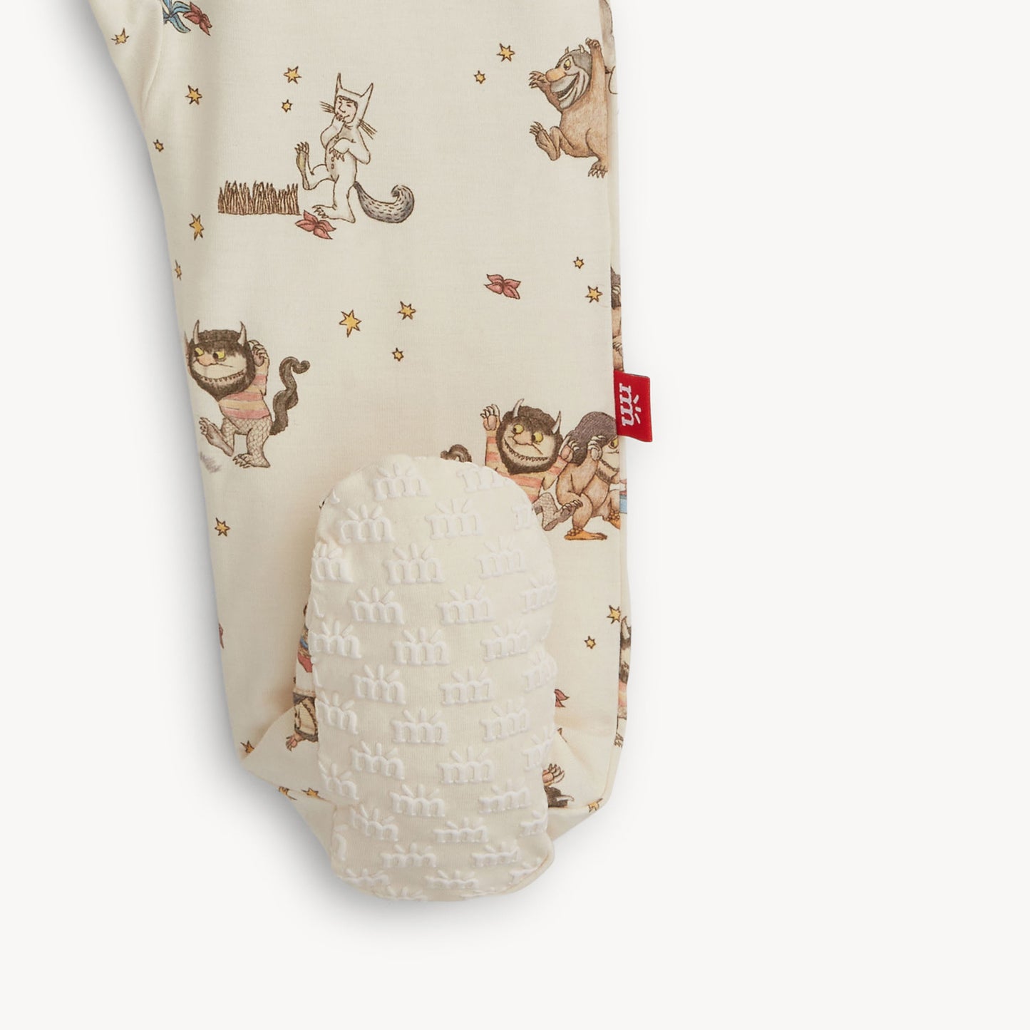 Baby footie with Where the Wild Things Are print showing the foot grips
