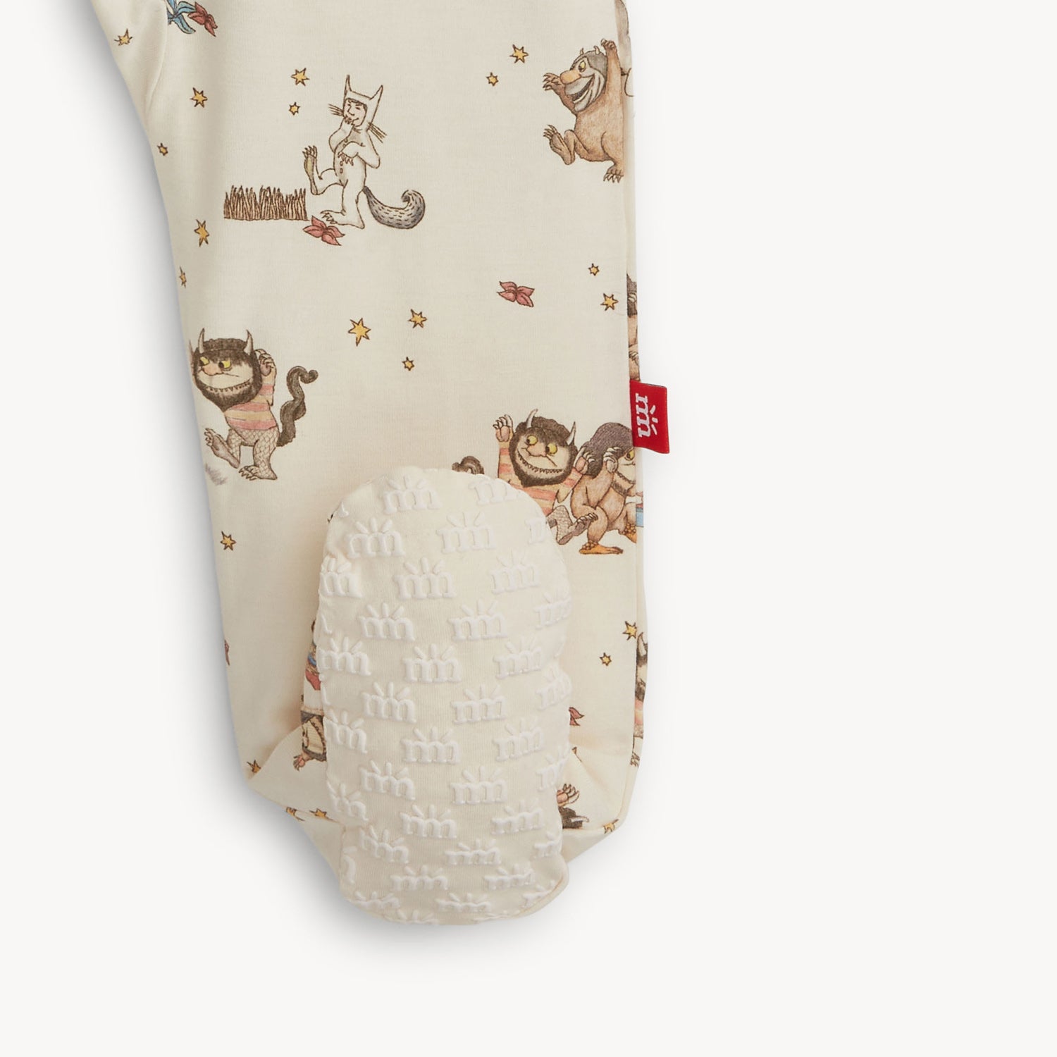 Baby footie with Where the Wild Things Are print showing the foot grips
