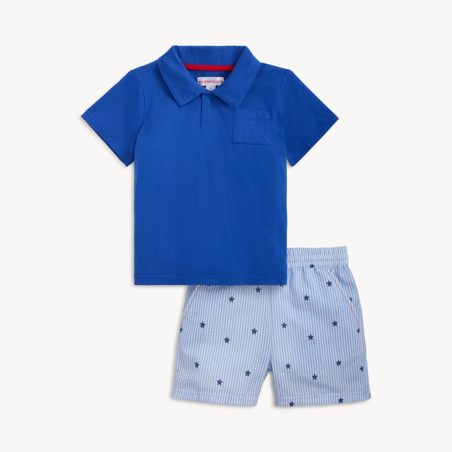 Blue polo shirt and star-patterned shorts set on a white background