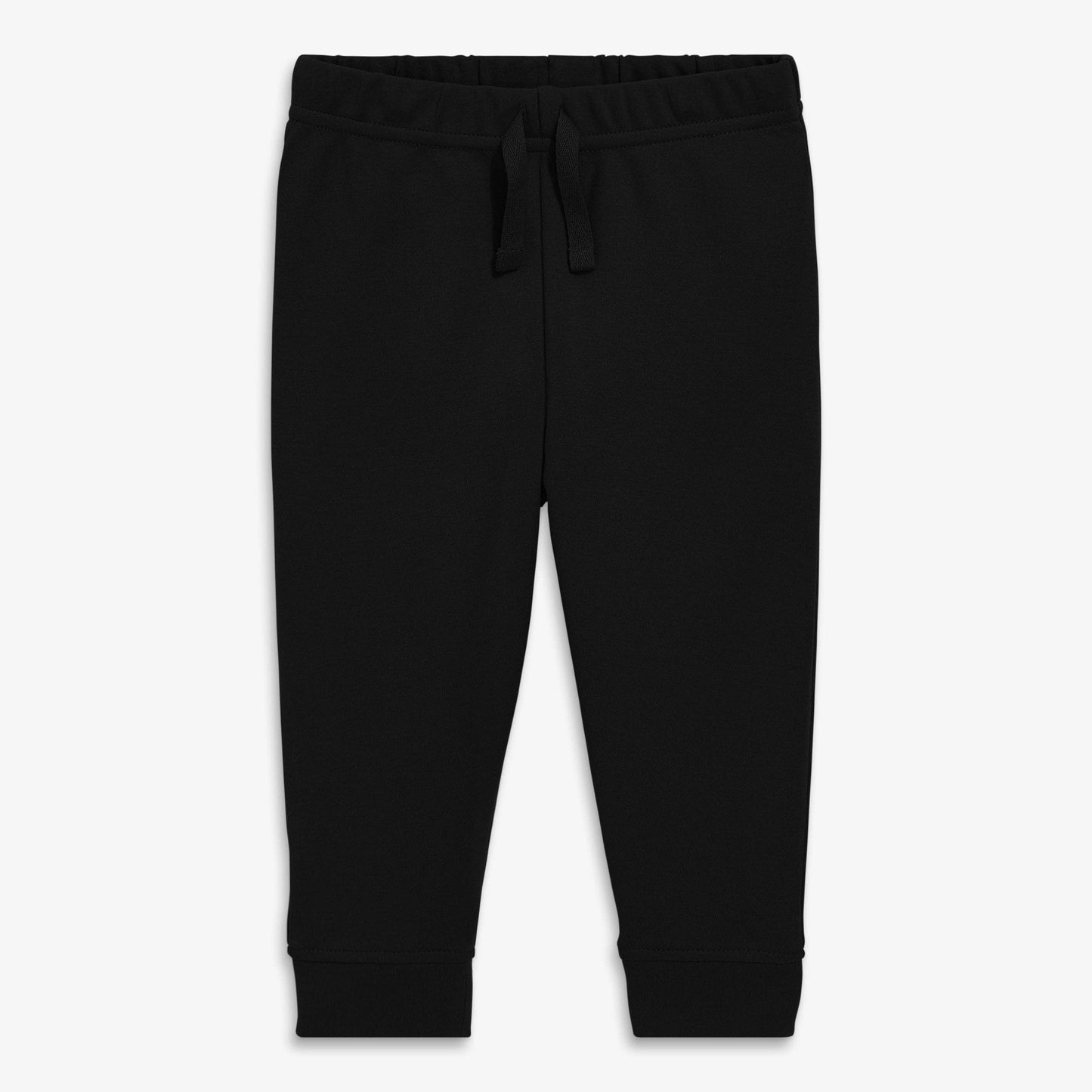 A pair of black organic baby pants with a waistband and decorative drawstring.