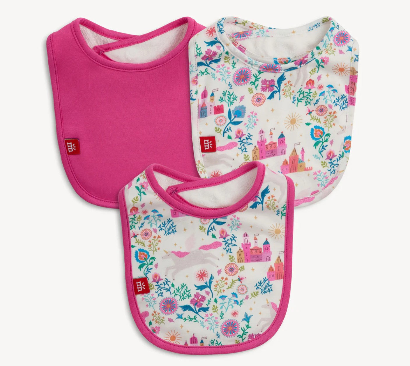 Three baby bibs with pink borders and castle-themed designs on a white background
