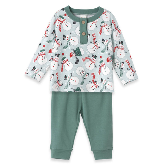 A set of children's Christmas clothing, featuring a long-sleeve henley top with a snowman pattern and green pants.