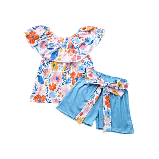 A boatneck floral short set with matching shorts and a tie belt
