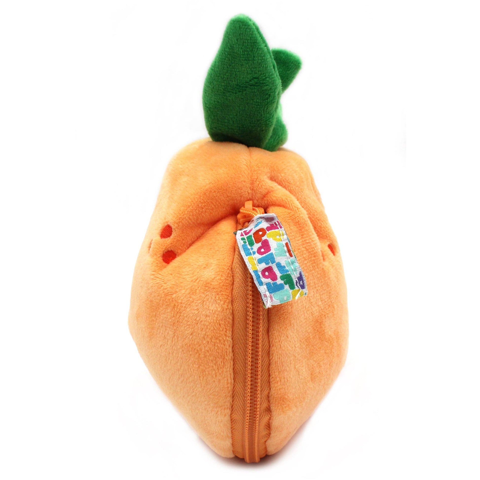 Plush tangerine toy with a colorful tag on a white background