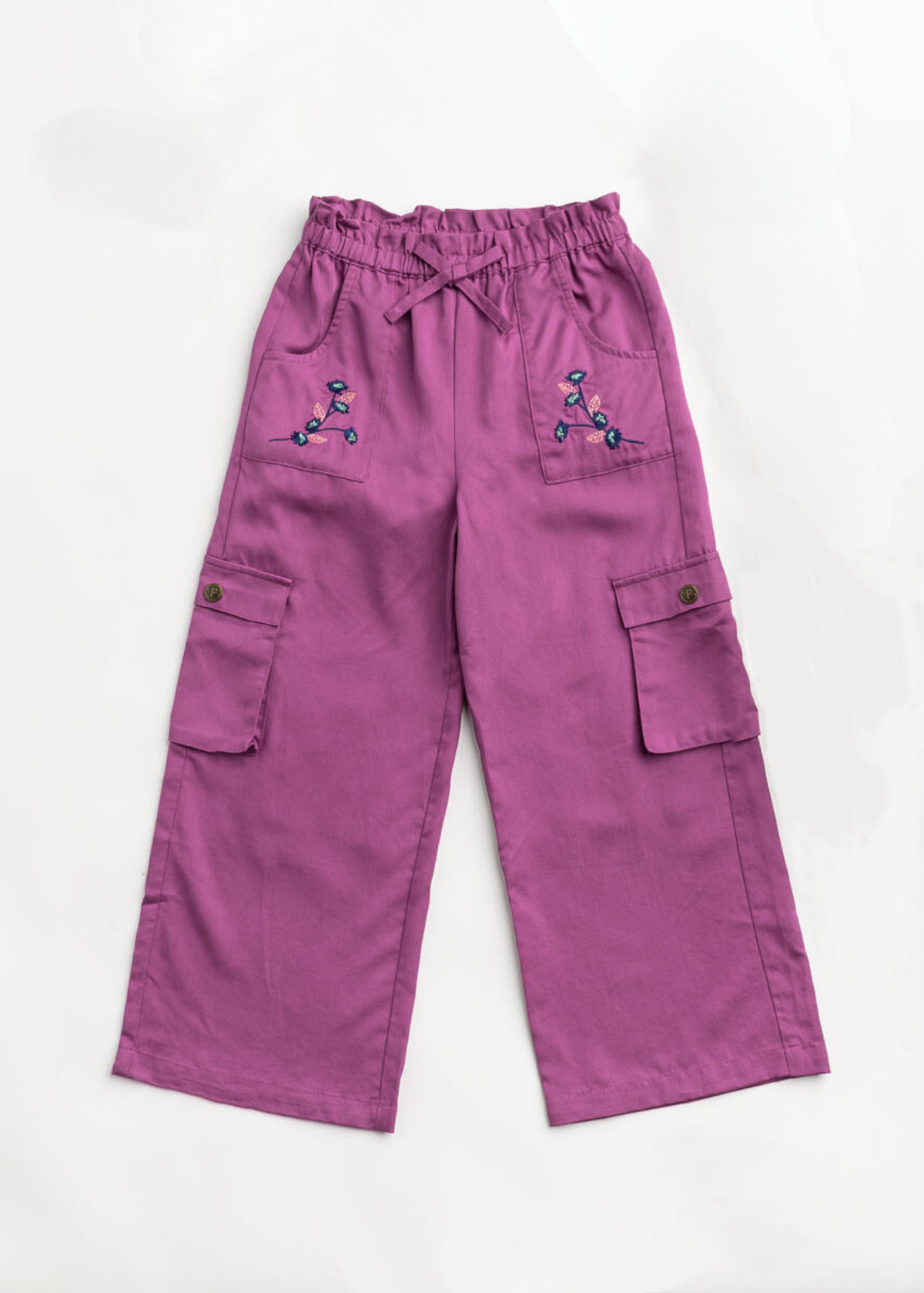 Purple cargo pants with decorative buttons on a white background