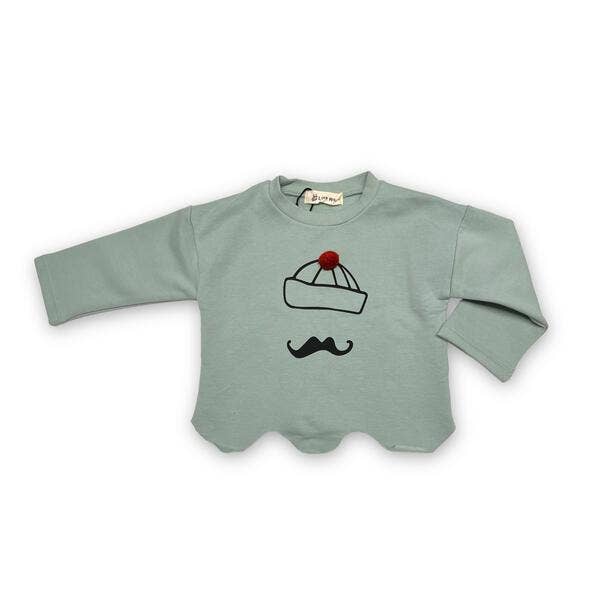 Light green baby sweater with a graphic design on a white background