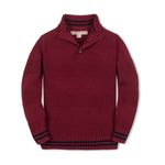 Red knitted sweater with black ribbed trim on a white background