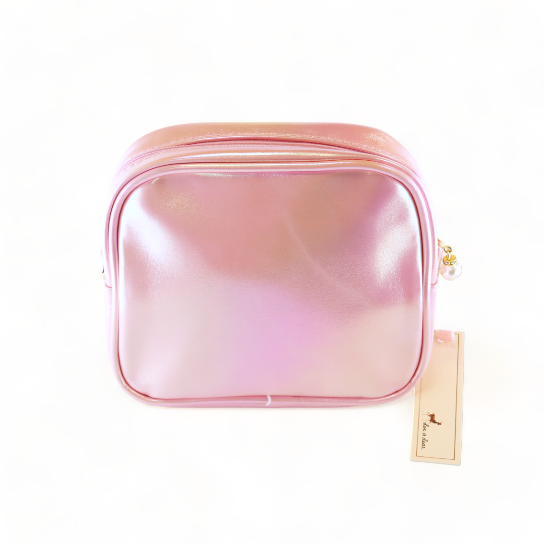 Pink gradient travel pouch with a visible brand tag on a white background