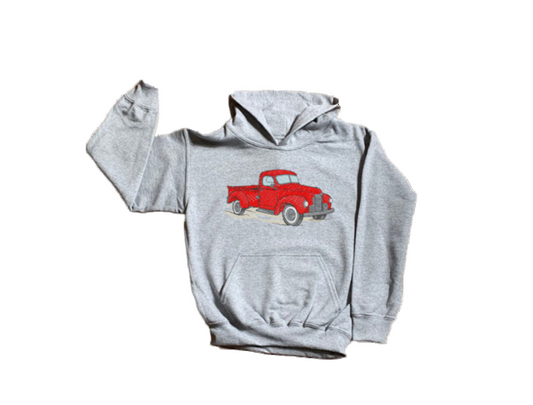 Gray hoodie with a red truck design on the chest against a white background