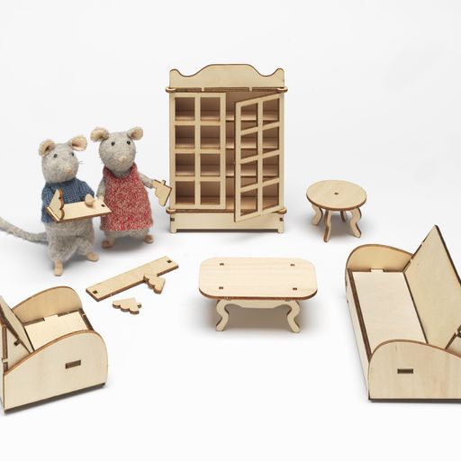 Set of wooden toy furniture and figures on a white background