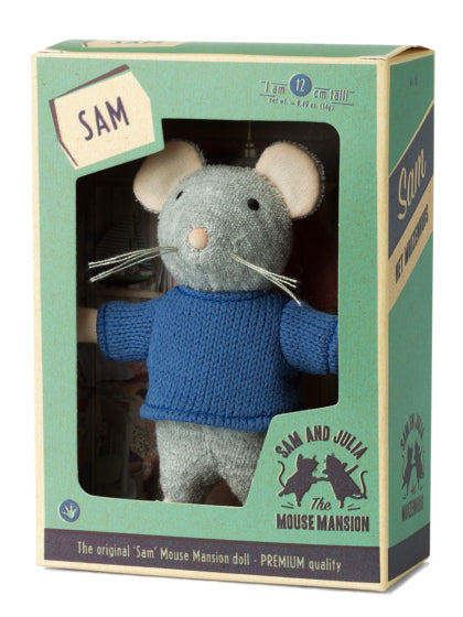 Toy mouse in a blue sweater in a packaging box with 'Sam' label, brand logo visible