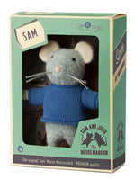 Toy mouse in a blue sweater in a packaging box with 'Sam' label, brand logo visible
