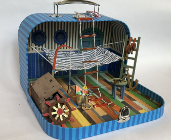 Toy set inside a suitcase with striped interior