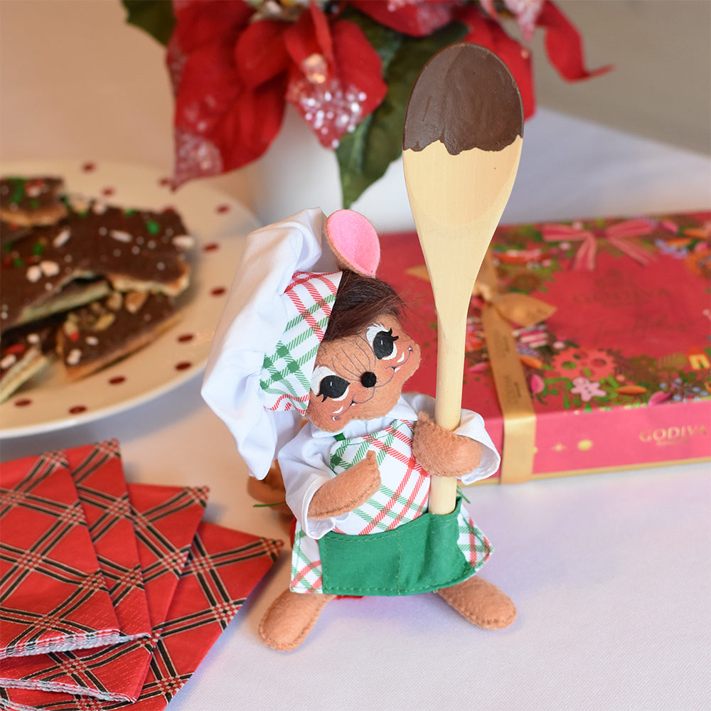 Annalee 6 inch Chef Mouse doll holding a mixing spoon, wearing a red, white and green plaid apron and chef’s hat