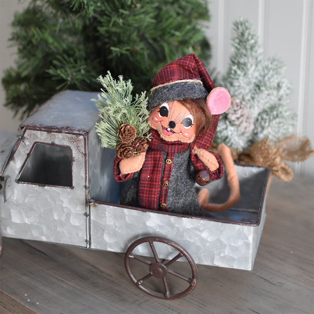 Annalee 6 inch Plaid & Pine Boy Mouse doll in a gray felt jacket and pants with a long winter hat, carrying pine sprays and pine cones