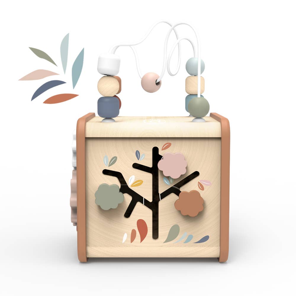 Wooden baby toy with beads and tree design on a white background