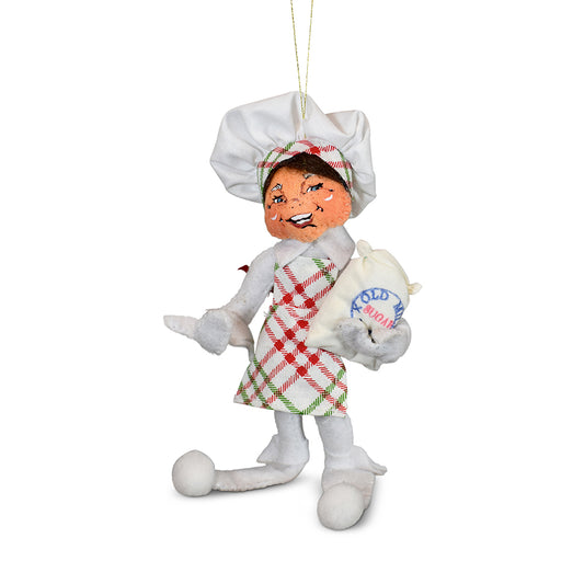 Annalee 5in Christmas Candy Elf ornament in white felt with chef hat and plaid apron holding a bag of sugar