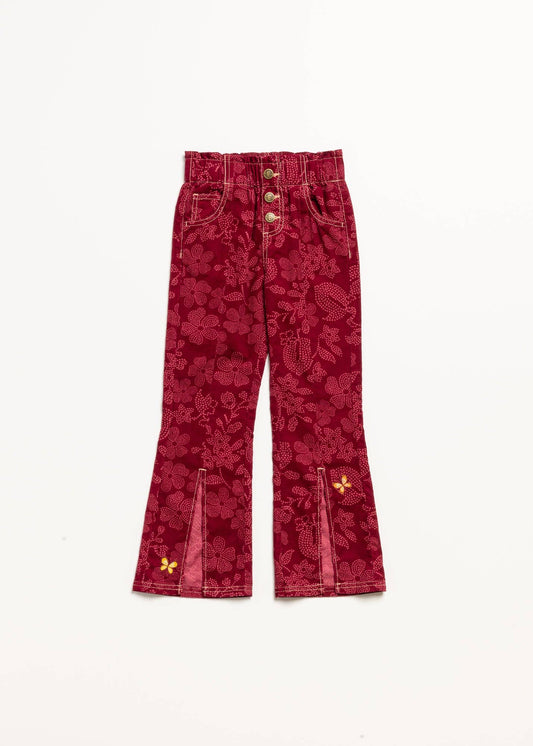 Red floral-patterned pants with gold buttons on a white background