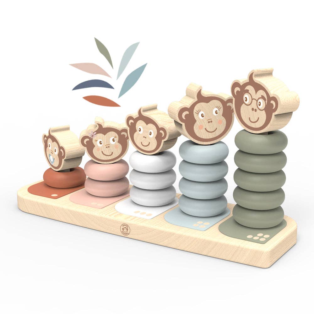Stacking toy with monkey faces and colorful rings on a white background