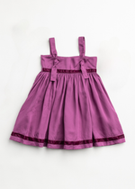 Purple dress with black trim on a white background