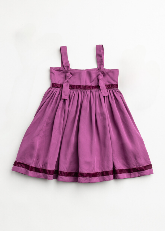 Purple dress with black trim on a white background
