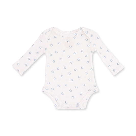 A long-sleeve baby bodysuit in white with a small, repeating light blue horseshoe pattern, displayed flat against a solid white background.