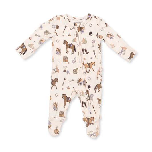 A baby long-sleeve footed sleeper in cream with an all-over equestrian-themed print of brown horses, boots, hats, and spades, shown flat on a white background.