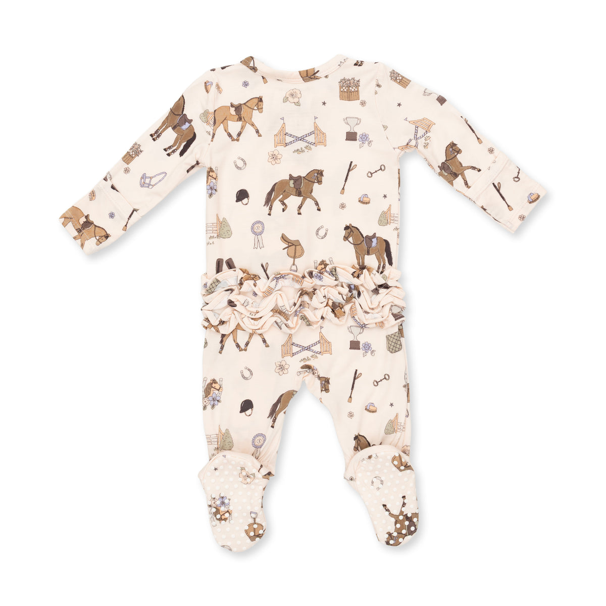 A baby long-sleeve footed sleeper in cream with an all-over equestrian-themed print of brown horses, reins, and bits, featuring a ruffled hem.