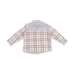 A children's long-sleeve plaid shirt shown from the back, featuring a white base with tan and light blue checks, a light blue collar, and 'Howdy U' embroidered in tan on the collar.