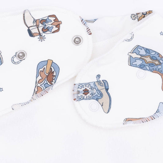 Bib Closeup of cowboy boots on a white background