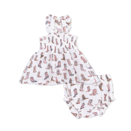 Baby romper with cowboy boot pattern on a white background