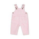 Pink children's overalls with button details on a white background