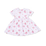 White dress with pink bellerinsa pattern on a white background