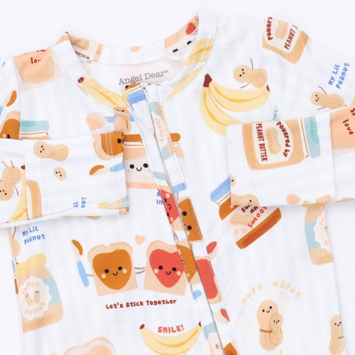 Baby footie close-up with cartoon peanut butter and jelly design on a white background