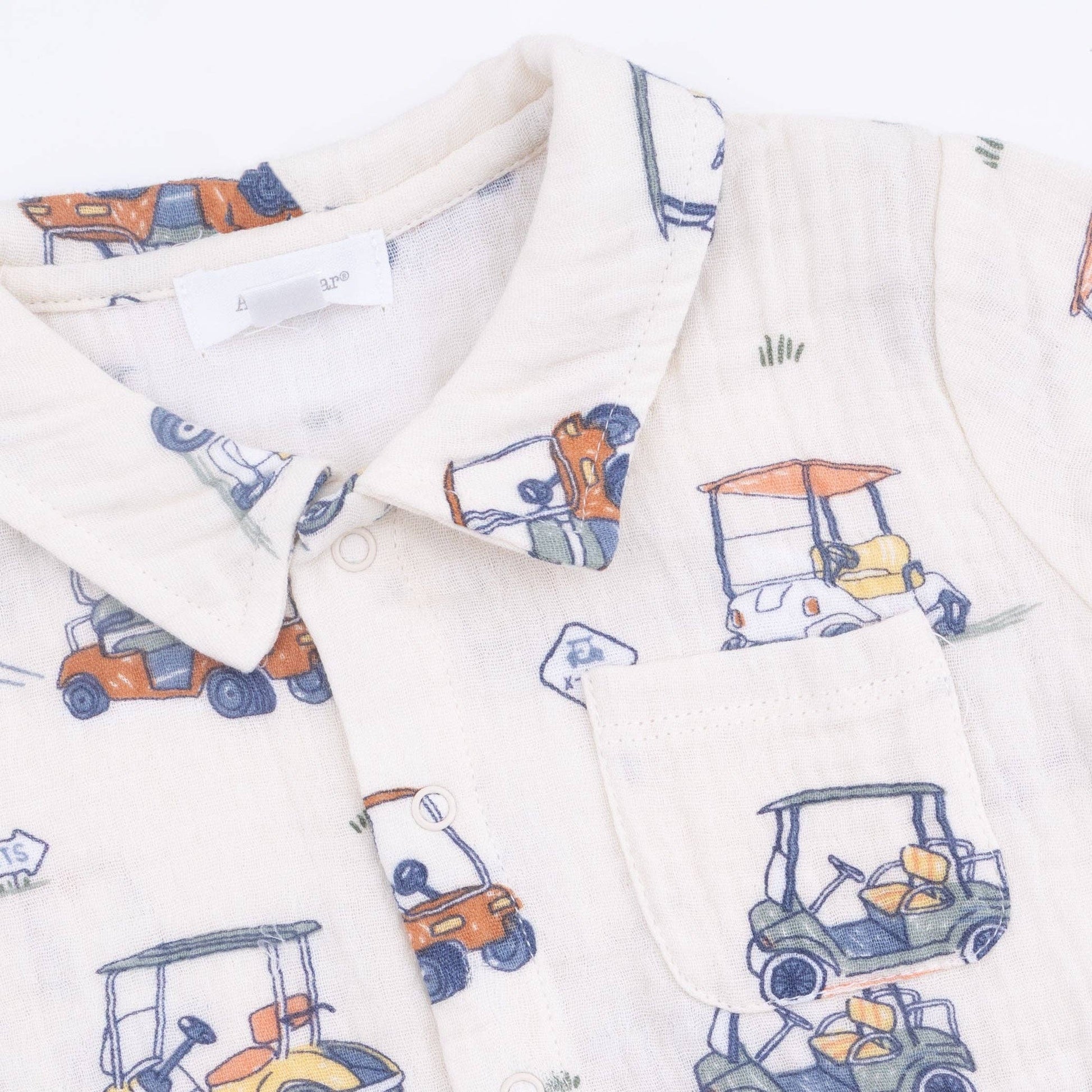 Closeup of Shirt with golf cart pattern on a white background