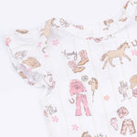 Patterned fabric with cowboy and horse designs on a white background