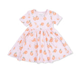 Pink dress with peach pattern on a white background