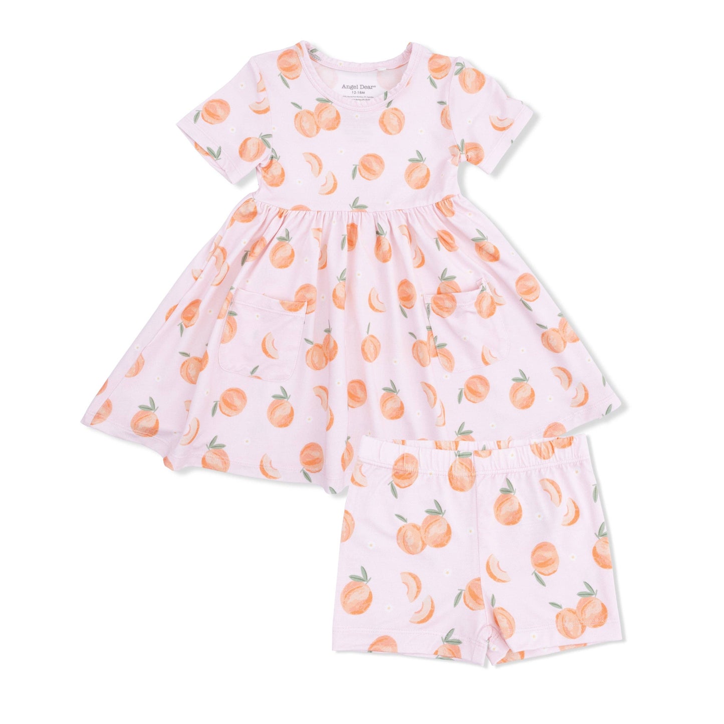 Pink dress with peach print on a white background