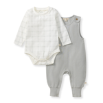 Baby outfit set with white bodysuit and gray overalls on a white background