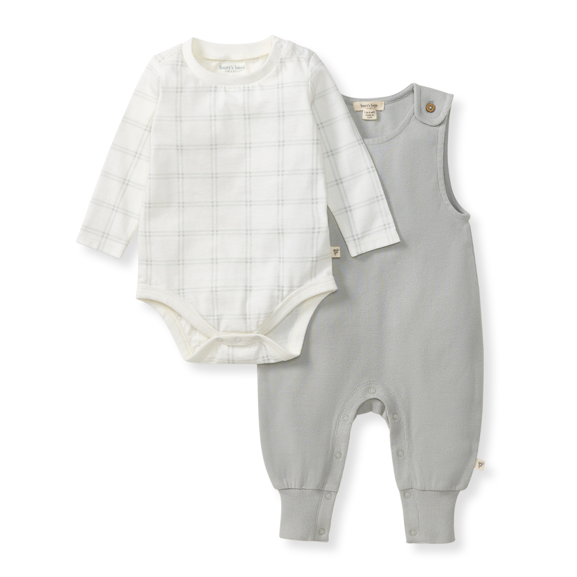 Baby outfit set with white bodysuit and gray overalls on a white background