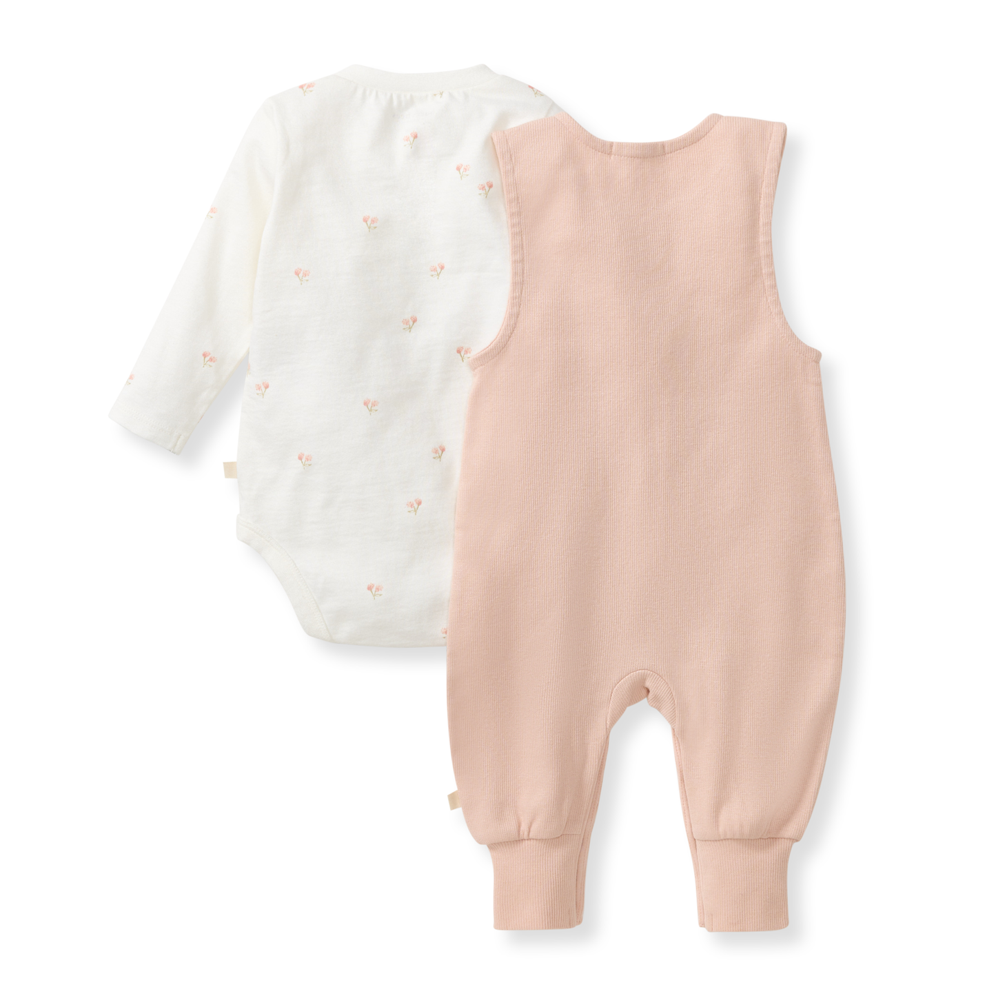 Baby romper with long-sleeve top and pink overalls on a white background