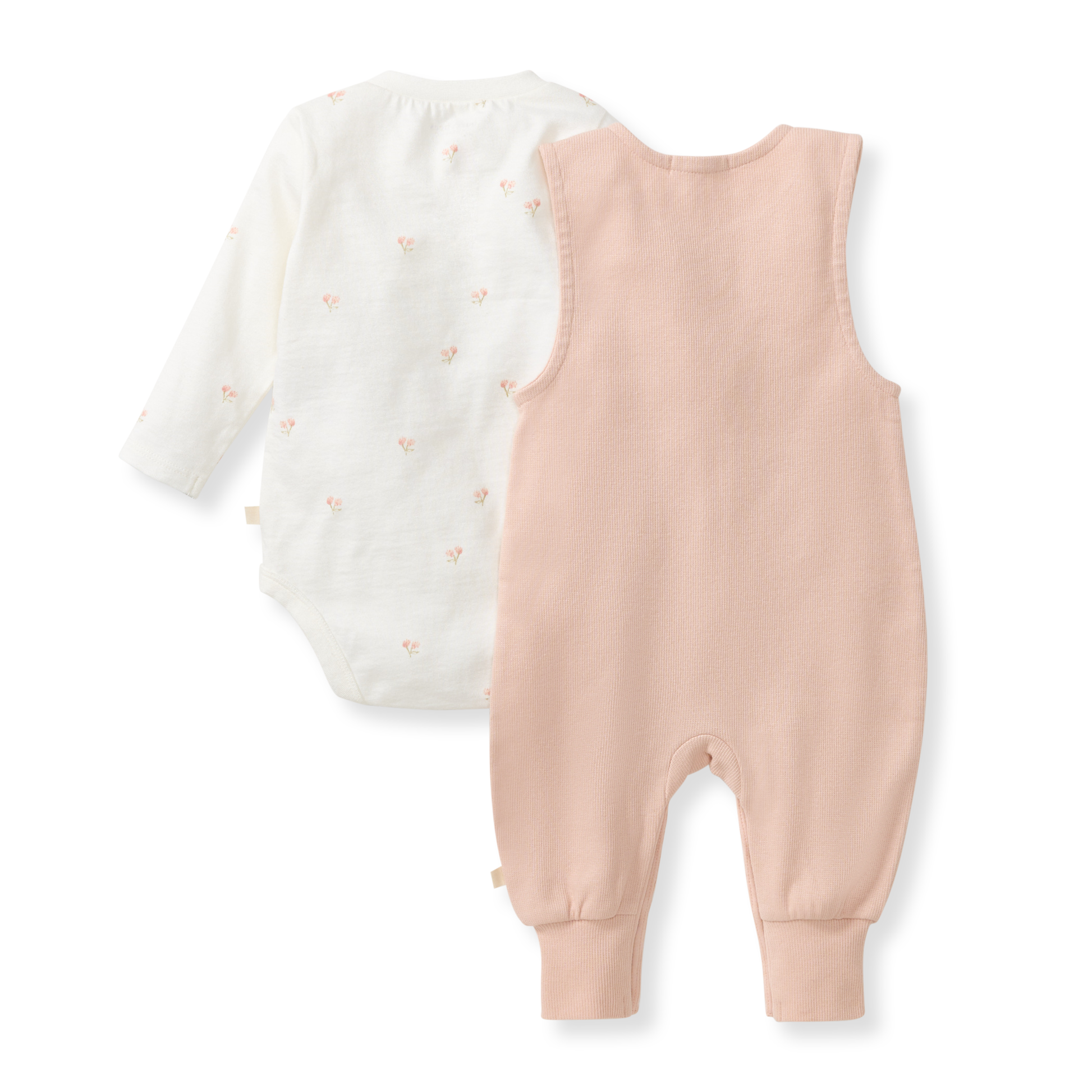 Baby romper with long-sleeve top and pink overalls on a white background