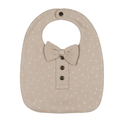 Beige baby bib with bow tie and button details on a white background